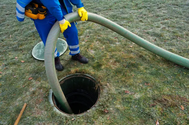Septic tank pumping hose in an open tank